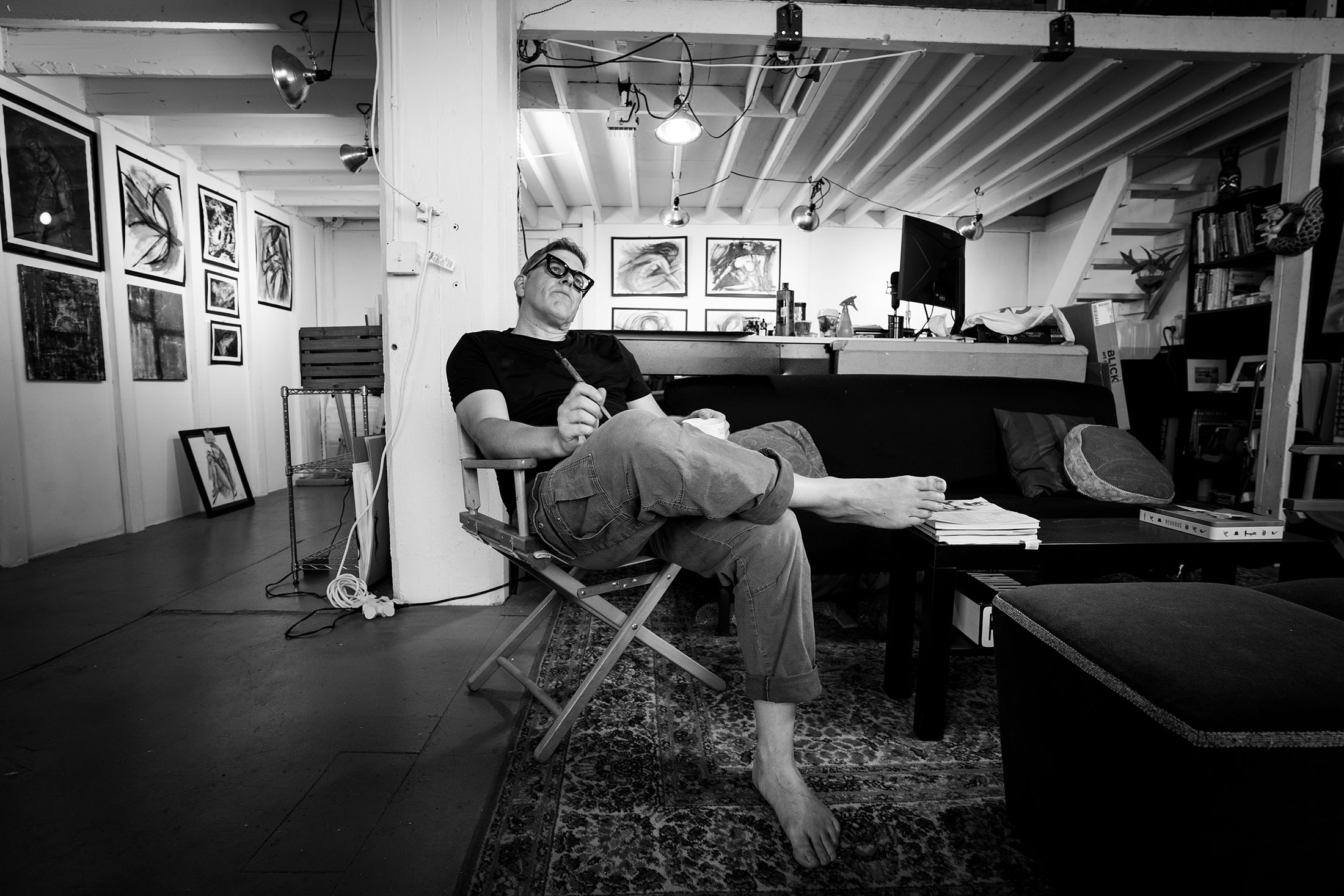 photo of Michael Tangen creating ink-based art